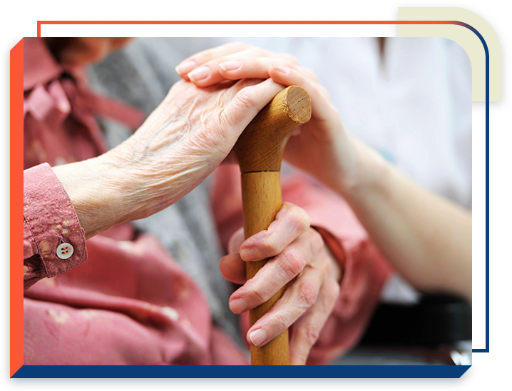 A person holding onto the handle of a stick