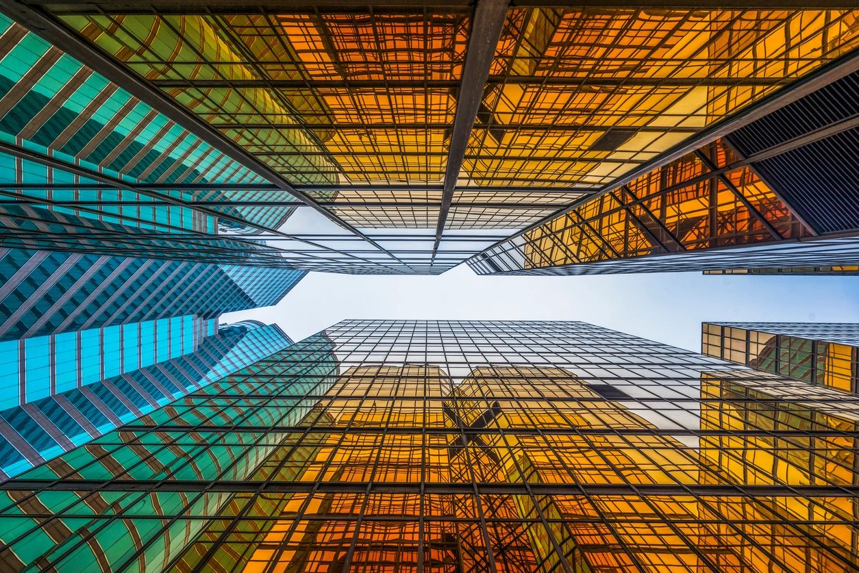 A view of the sky from below looking up at some buildings